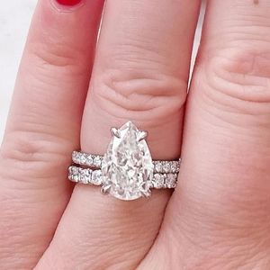 Gorgeous pear shaped diamond ring and band, 4.8 carat total weight.